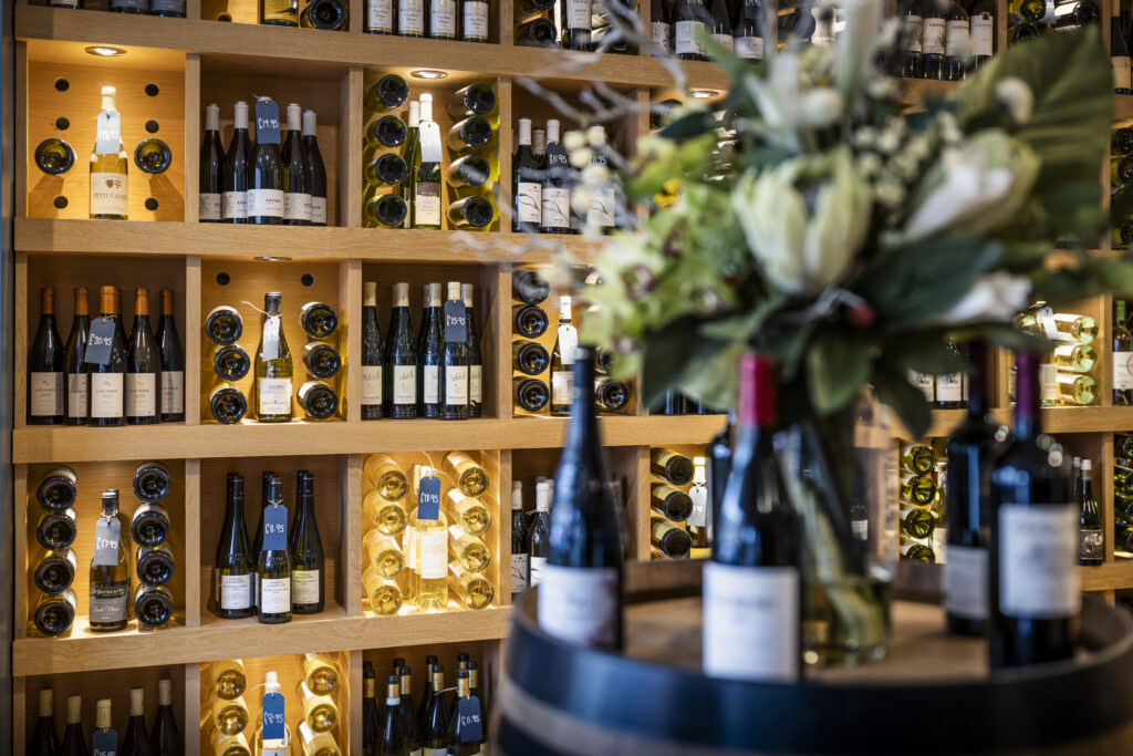 A wall of fine wines and flowers from Fairview Wines on North Street in Midhurst, West Sussex.