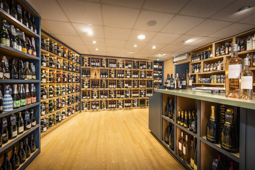 An interior view of Fairview Wines on North Street in Midhurst, West Sussex, showcasing a range of quality wines.