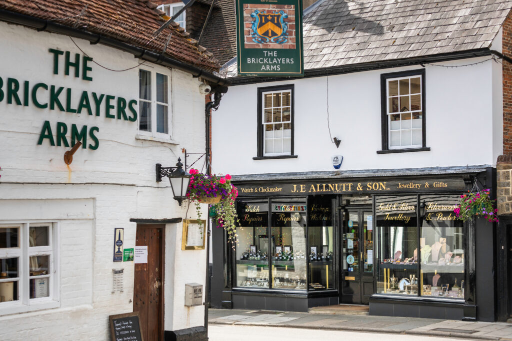 View of JE Allnutt & Son Jewellers opposite The Bricklayers Arms pub in West Street, Midhurst.