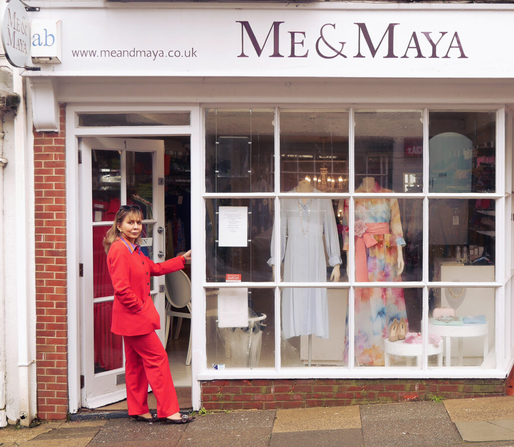 A staff member of Me & Maya stood in her shop entrance, Midhurst, West Sussex.