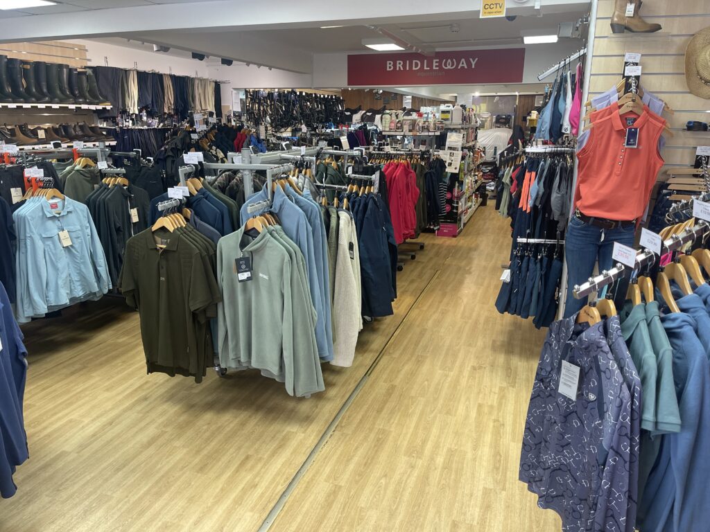 The interior of Stockley Outdoor & Equestrian showing a wide range of outdoor clothing.