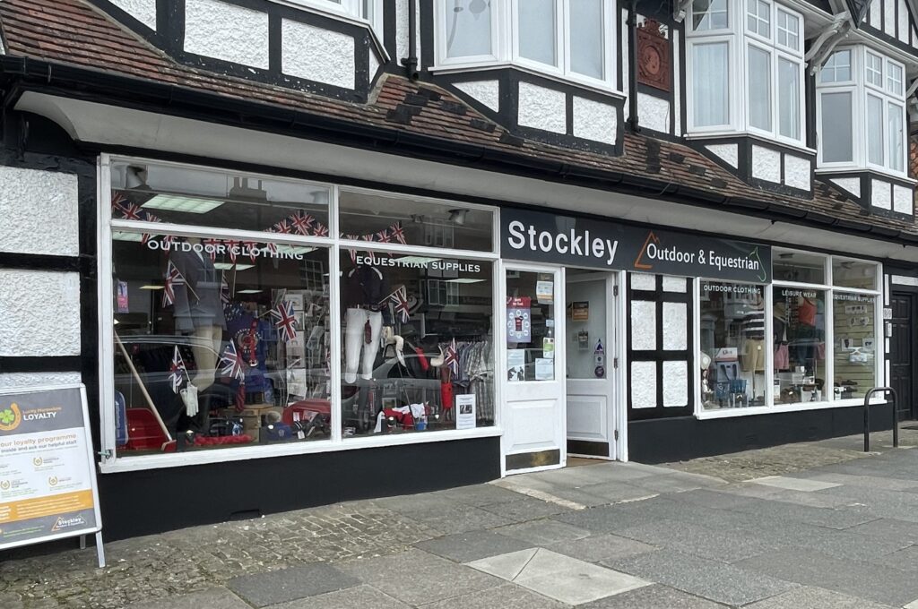 The shopfront of Stockley Outdoor & Equestrian on North Street in Midhurst, as seen from the pavement.