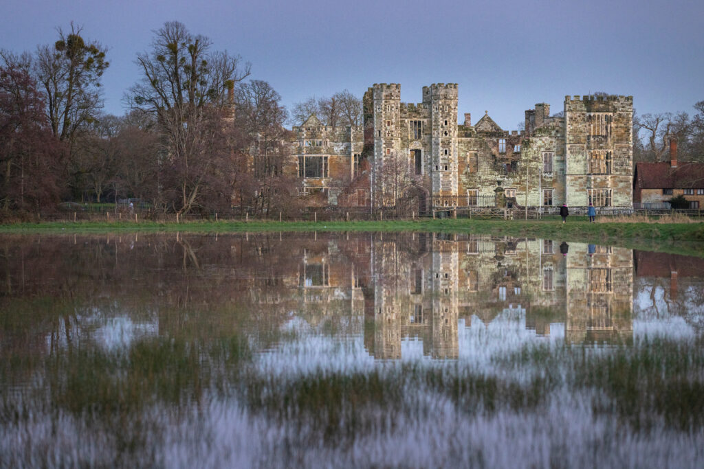 The flooded water meadows in front of Cowdray Castle ruins, Midhurst, West Sussex.